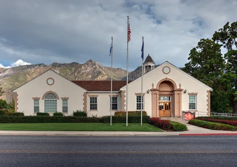 Alpine City Hall on Main Street, with the Wasatch peaks behind it