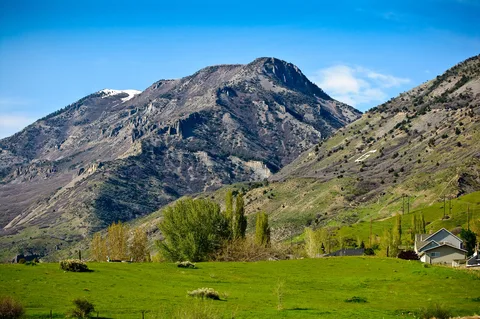 Green fields on Lindon's east side below the Wasatch Range on a clear spring day