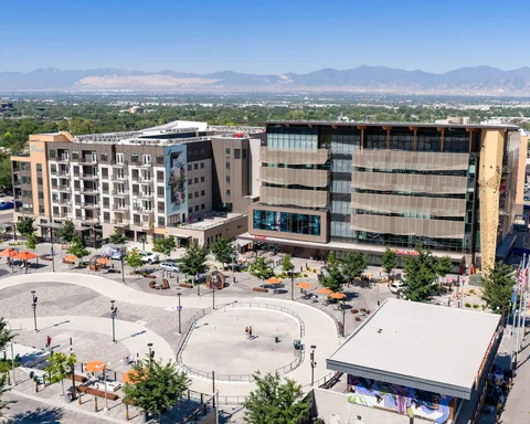 Millcreek City Hall and the skate loop at Millcreek Common, with the Oquirrh Mountains on the horizon