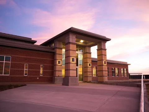 North Salt Lake City Hall glowing at sunset under a pink sky