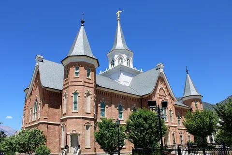 The Provo City Center Temple in downtown Provo under a clear blue sky