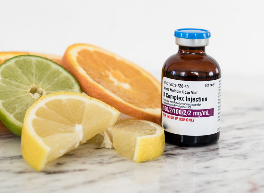 B-Complex Vitamin Therapy for vitamin b complex injections next to some sliced citrus