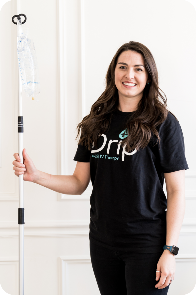 Smiling nurse holding an IV bag ready to give IV therapy in centerville