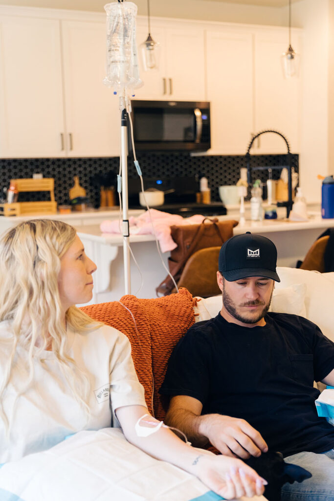 Two patients getting an IV in their home