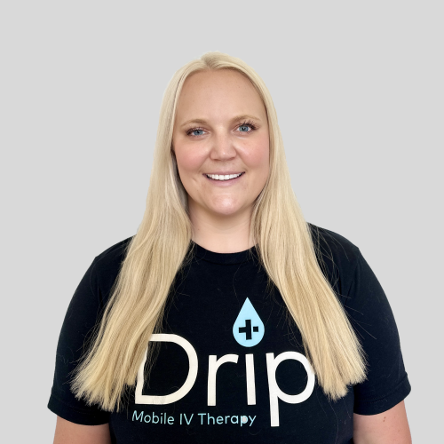 Smiling nurse wearing drp iv mobile therapy shirt