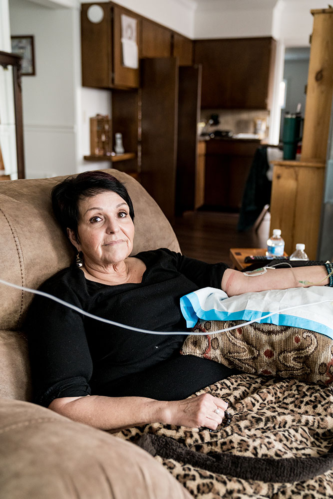 Woman in a lounge chair receiving Infusion Therapy For Rheumatoid Arthritis