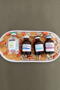 Vitamin Bar Vials Lined Up on Oral Supplements