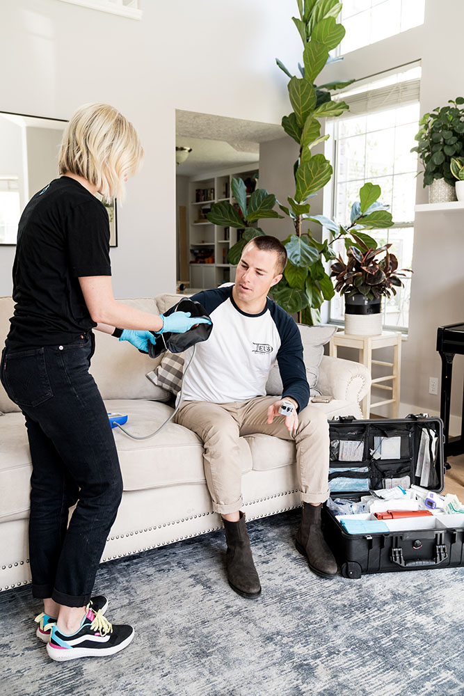 Man being prepped to receive ozone therapy at home by getting his blood pressure taken by Drp IV nurse