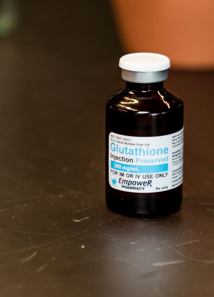 Before and After Glutathione Injection - Glutathione vial on a counter