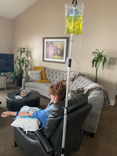 Woman getting an IV from Live Well Nutrition