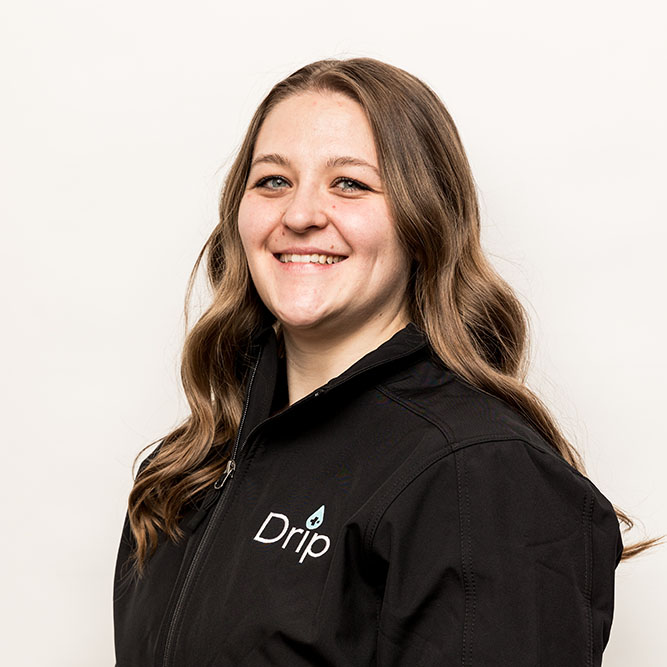 Dispatcher Ashlee smiling while wearing a drp iv jacket