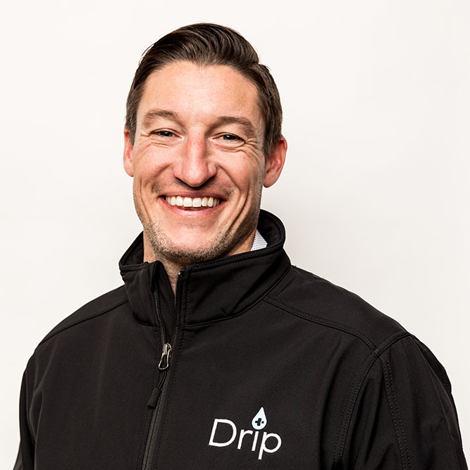 Co-owner Jameson Bangerter smiling at the camera while wearing a Drp IV jacket