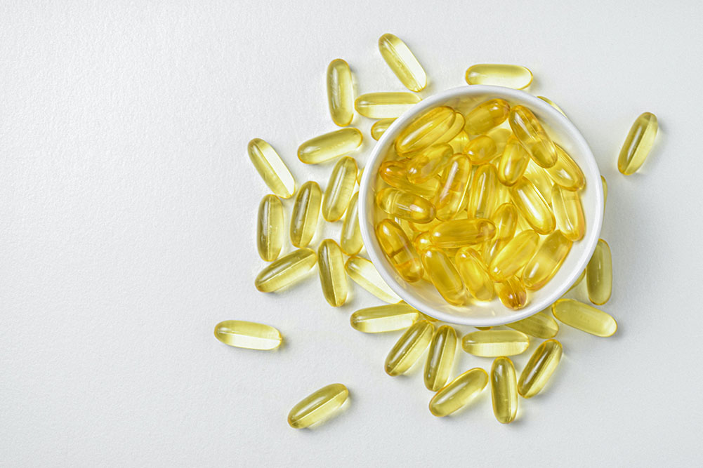 Small bowl of vitamin d pills for how to get vitamin d in winter