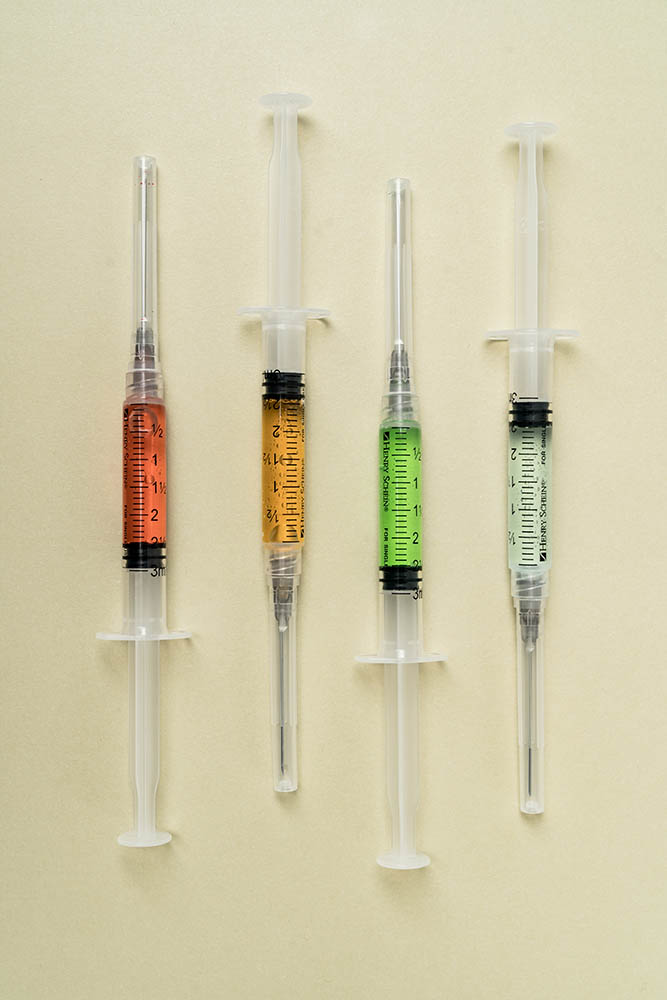 A line up of syringes of vitamin shots